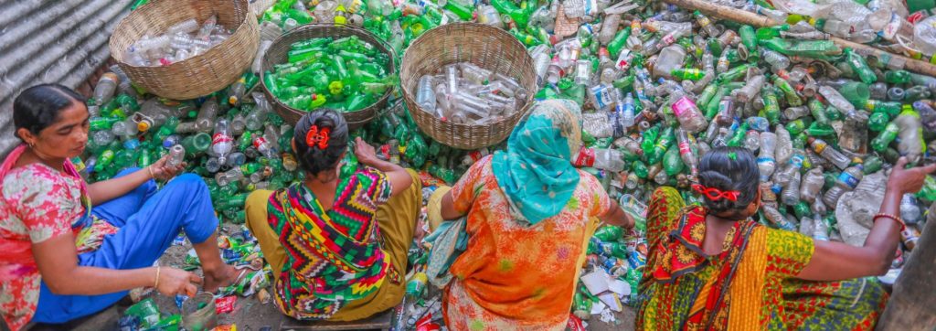 Four women sorting plastic bottle easte